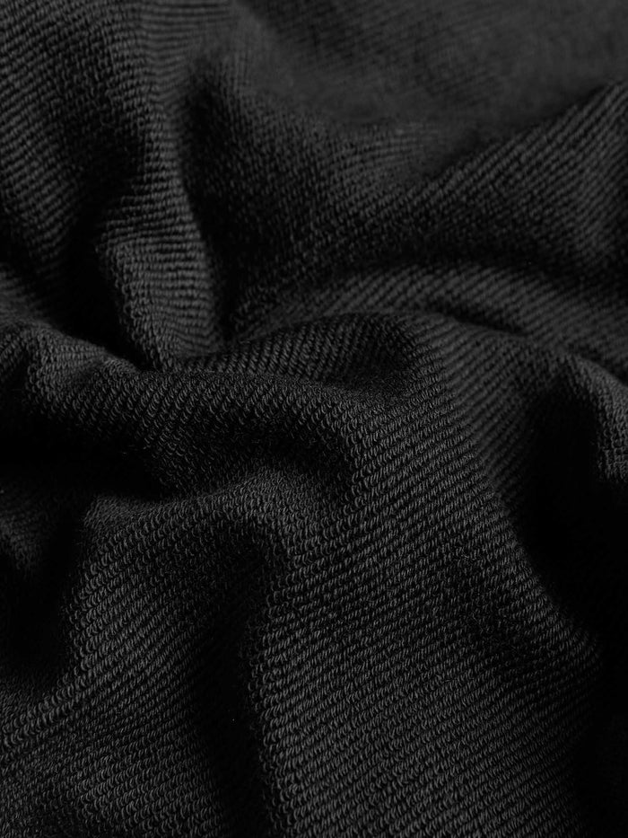 Kids' 365 black midweight sweatshirt fabric detail, 320 GSM organic cotton with soft, textured knit pattern