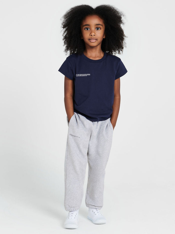 Child in Kids' 365 Midweight T-shirt navy blue, 320 GSM organic cotton, oversized boxy fit, crew neck