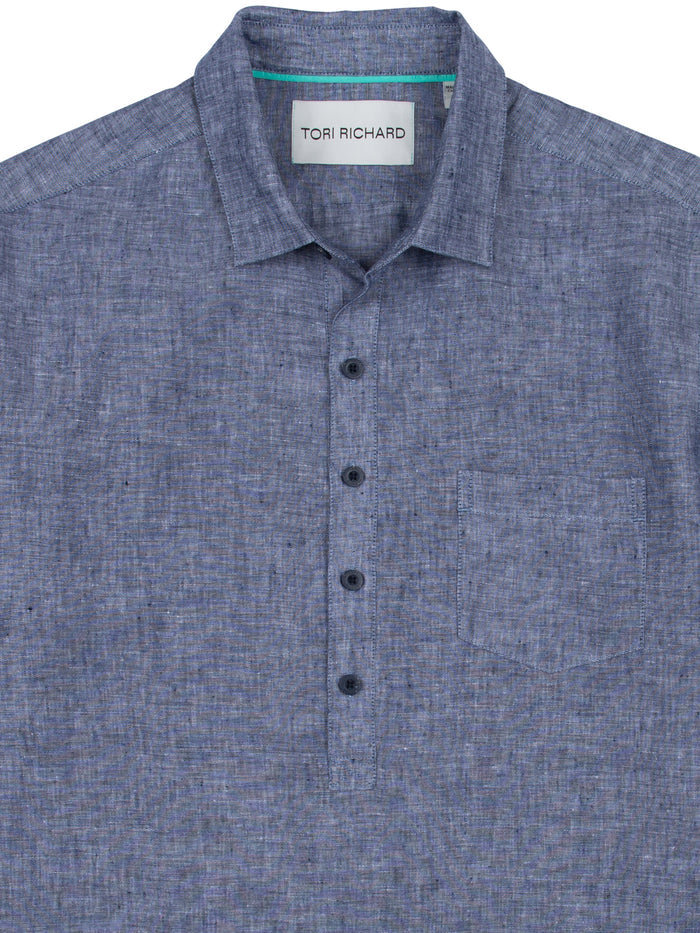 Blue slub linen shirt with collar, chest pocket, and half-placket, front view.