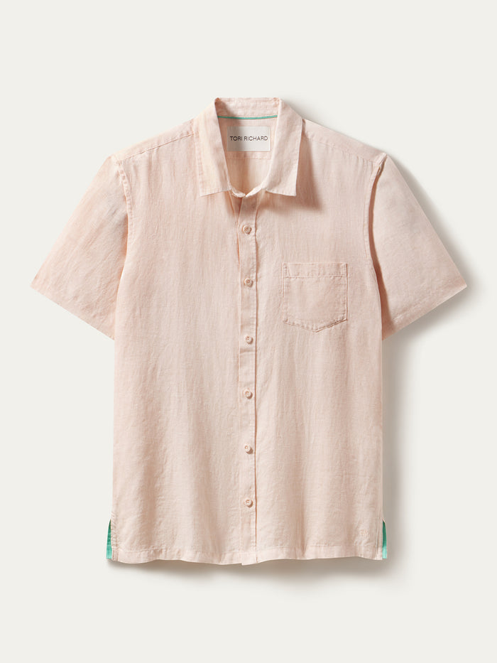 Light pink slub linen short-sleeve shirt with chest pocket, shown in a flat lay view.