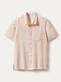 Light pink slub linen short-sleeve shirt with chest pocket, shown in a flat lay view.