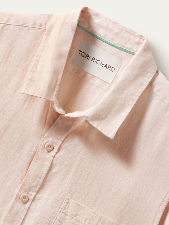 Light pink slub linen short-sleeve Kona shirt, shown close-up from the front neck part.