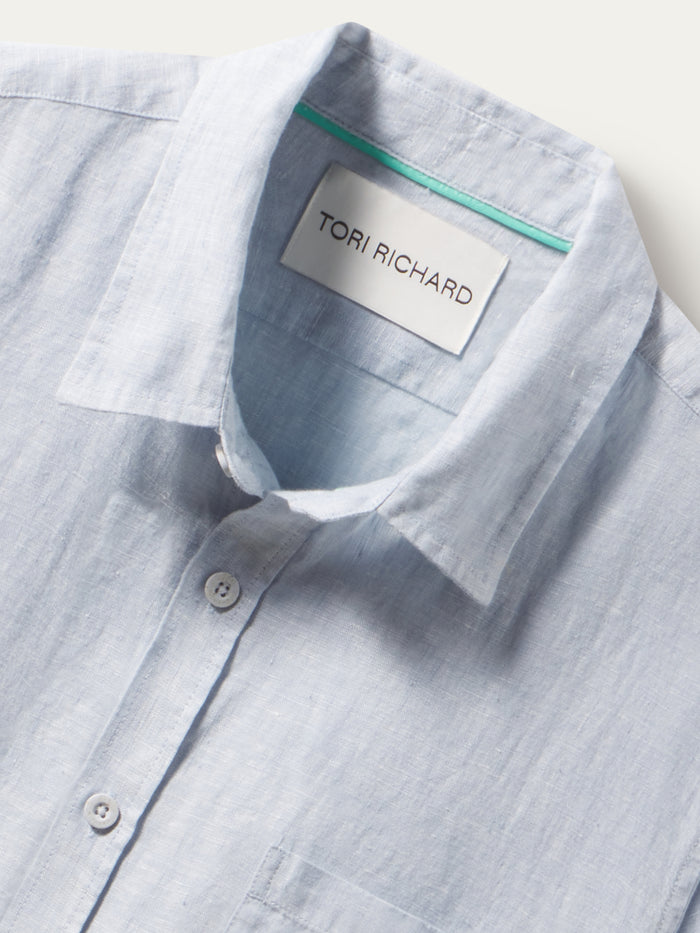 Kona light blue slub linen short-sleeve shirt, shown in a close-up view of the front neckline.