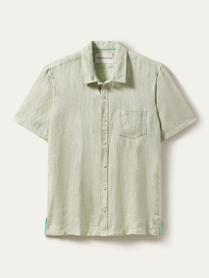 Light green solid short-sleeve linen shirt with chest pocket, shown in a front flat lay view.
