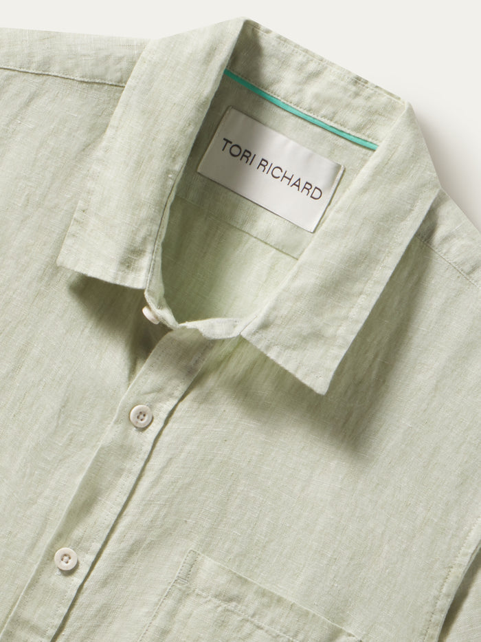 Kona light green slub linen collared shirt, shown in a close-up view of the front neckline.