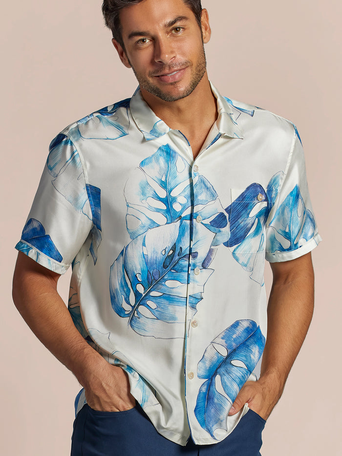 Blue leaf print short-sleeve twill shirt, front view on model with hands in pockets