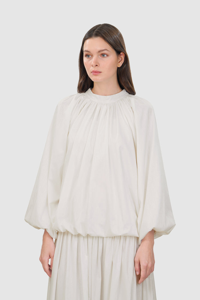 leena cotton ruffle blouse in white by buttonscarves front view