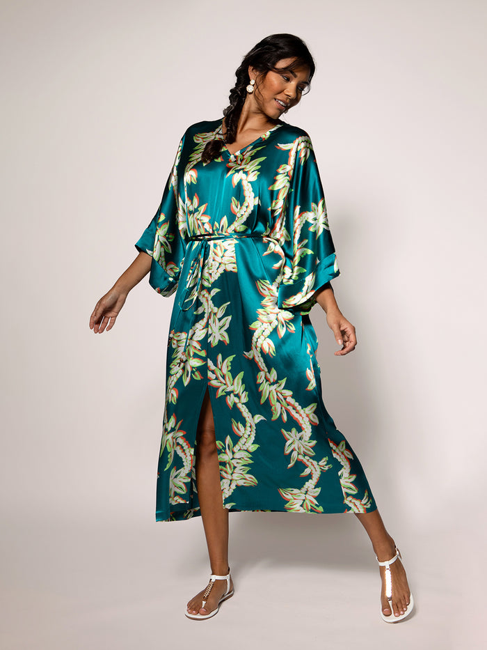 Teal floral-print Calliope dress with waist tie, front view, light background.