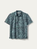 Teal and black leaf-print short-sleeve button-up shirt, laid flat, front view