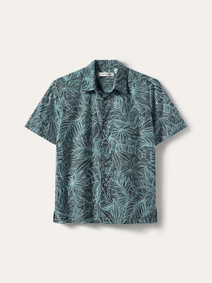 Teal and black leaf-print short-sleeve button-up shirt, laid flat, front view