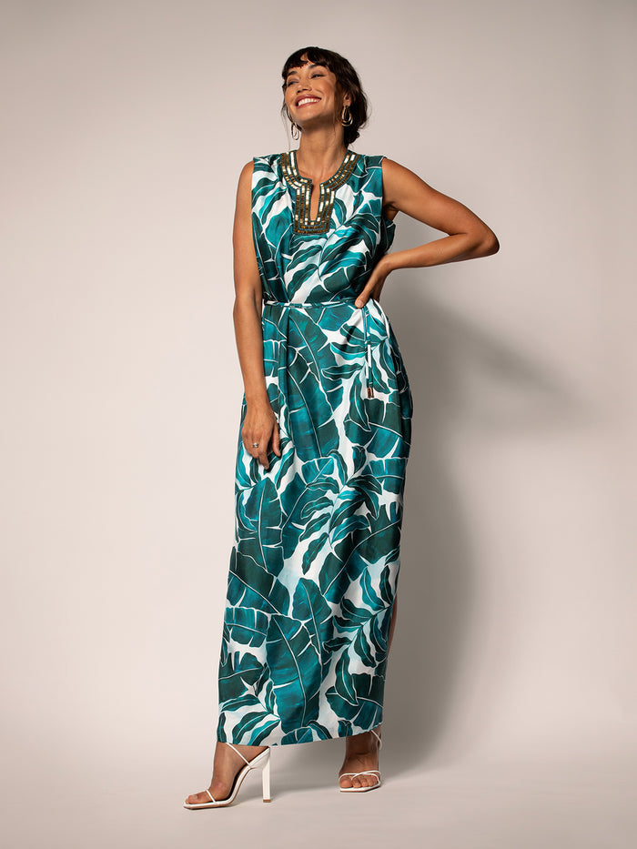 Green patterned sleeveless midi dress with v-neck, shown in front full-body view.