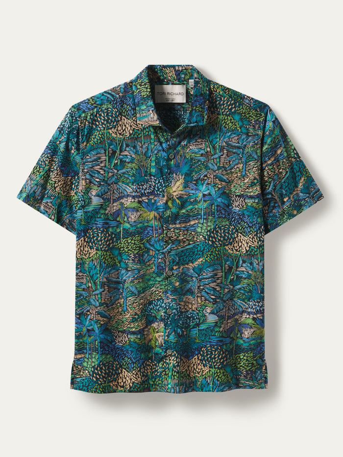 Blue-green jungle print short-sleeve shirt on white background, front view.