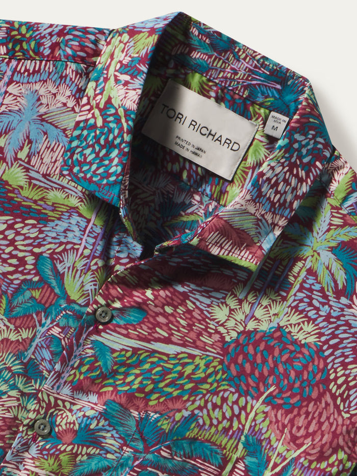 Close-up of Green, blue, red, purple tropical-print Hawaiian shirt with Tori Richard label in collar.