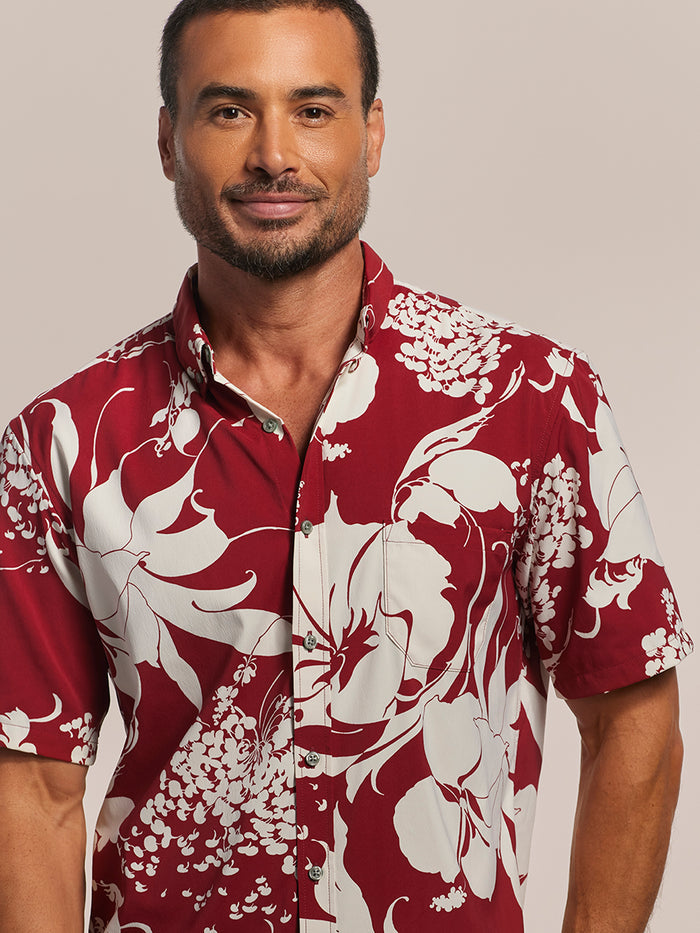 Red and white floral-print short-sleeve Hawaiian shirt, closed-up front view.