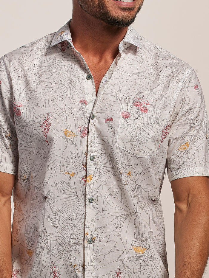 Beige floral and bird print short-sleeve Hawaiian shirt, front view.