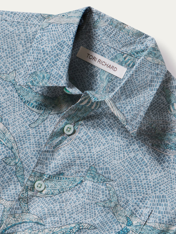 Blue dolphin mosaic-print shirt, close-up of Tori Richard woven brand label and front detail.