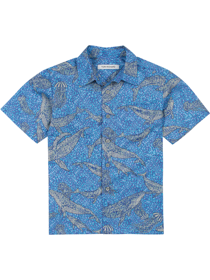 Blue ocean and whale-print cotton shirt for boys, front view on white background.