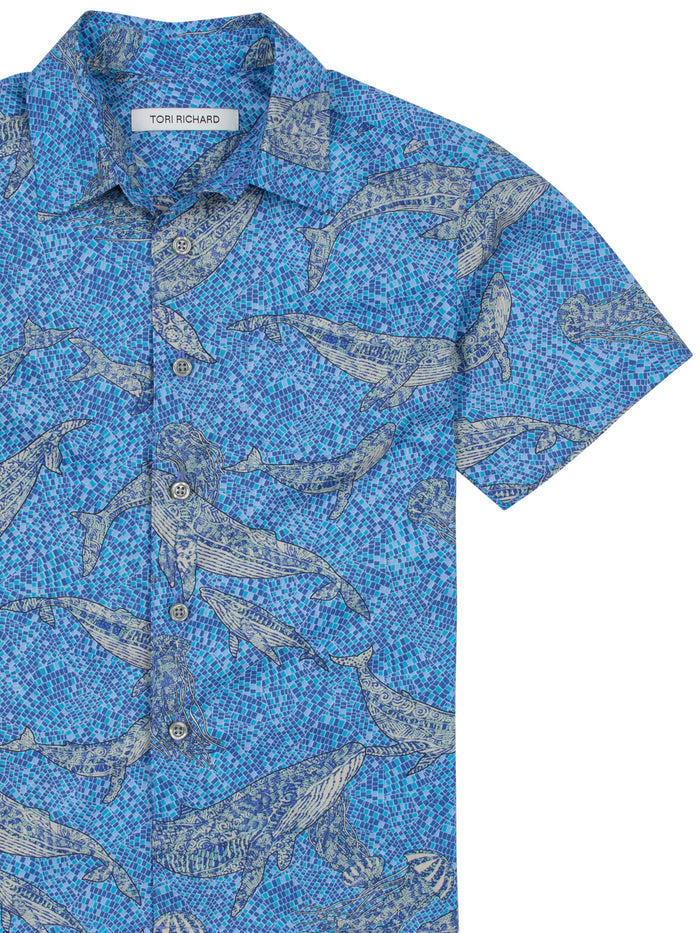 Blue whale-print short-sleeve button-up shirt, front view.