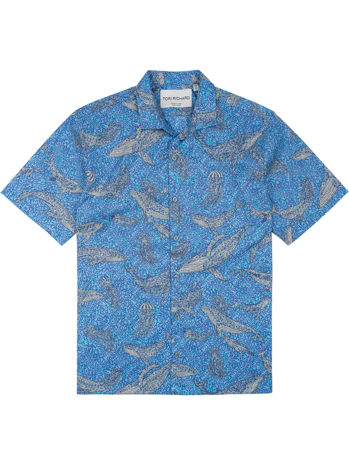 Blue fish-pattern short-sleeve button-up shirt, flat lay on white background.