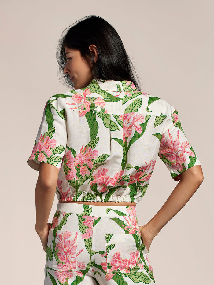 Multicolor floral-print Mariposa Selena top and matching pants, back view, hands on hips.