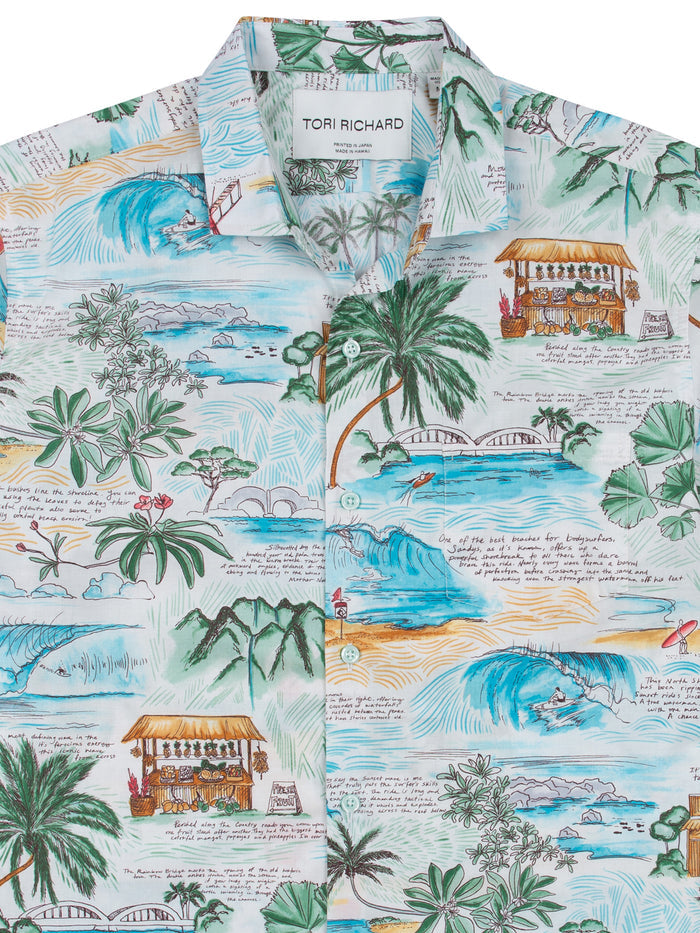 Multicolor island-print cotton shirt with beaches, palm trees, huts; front view.