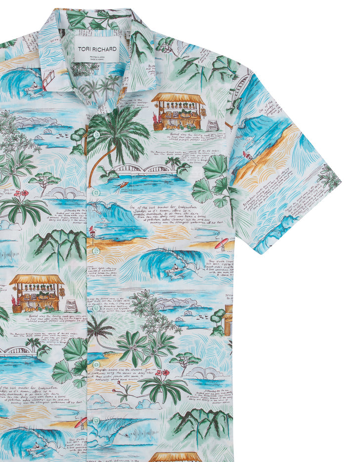 Blue, green, and tan tropical island-print large journal, cover and front cover views.