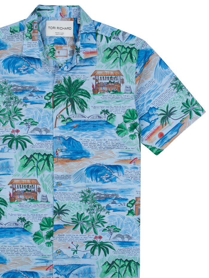Image 1: Tropical island/ocean-print tall cotton lawn journal cover. Image 2: Palm tree/hut-print version, front view.