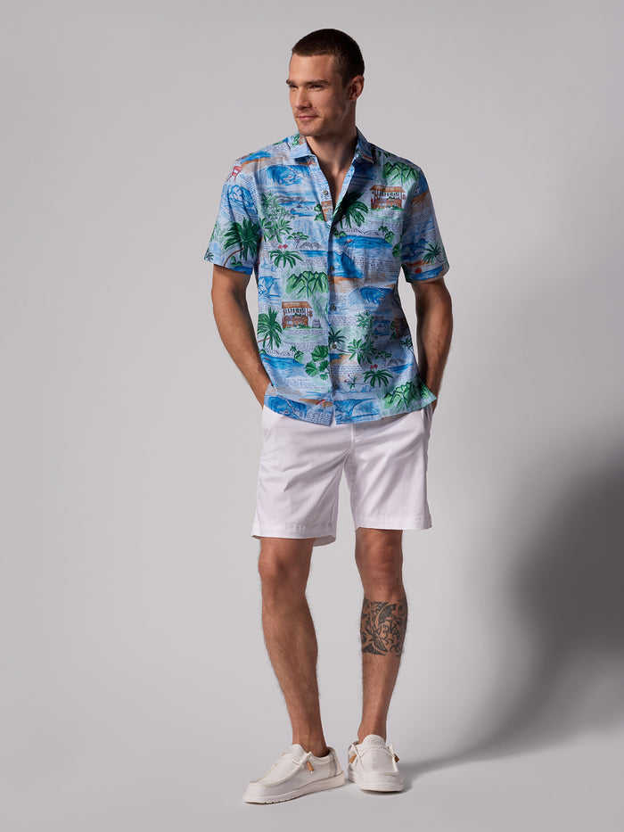 White solid shorts, white sneakers, full-length front view of a model.