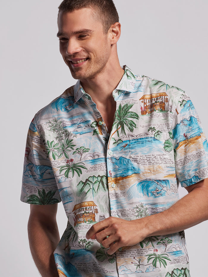 White and green tropical-print cotton shirt, front view.  Tropical-patterned shirt, chest-up view.