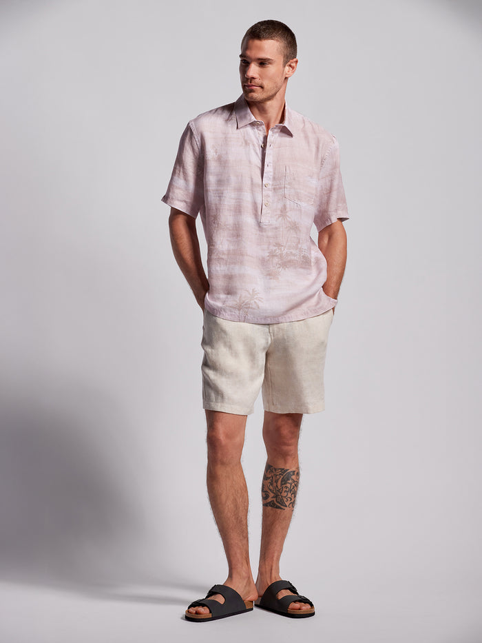 Pink Mirage half-placket shirt, beige shorts, black sandals, hands in pockets, full-body view (Images 1 & 2).