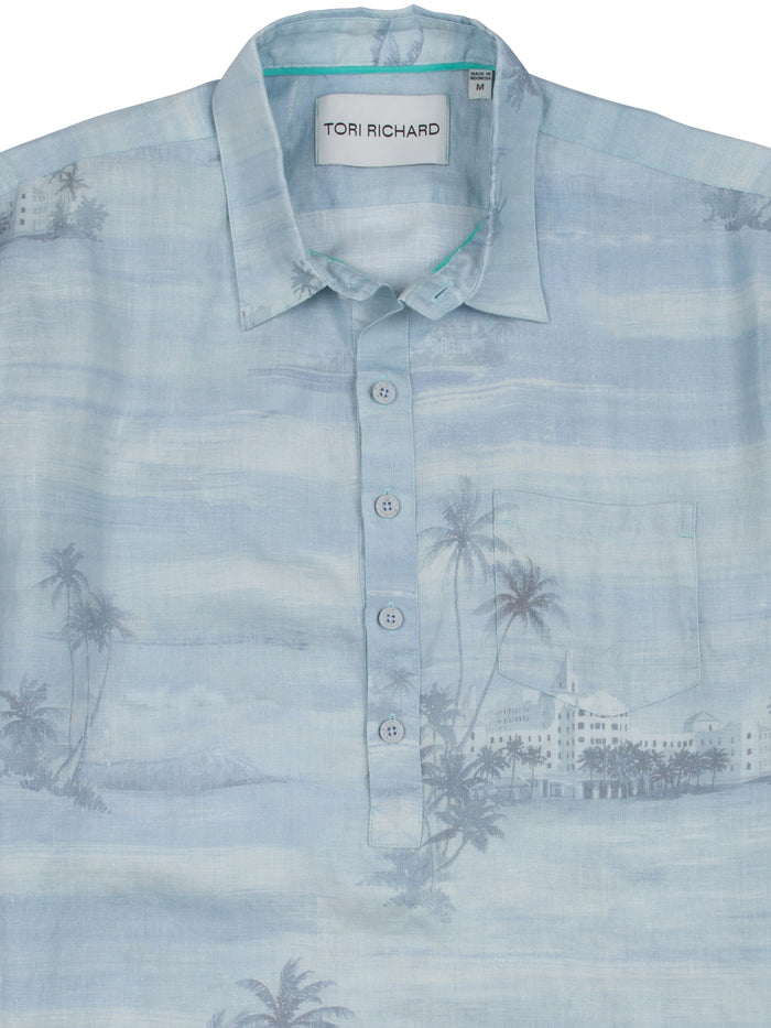 Light blue tropical-print linen shirt with chest pocket, shown in front view (Images 1 & 2).