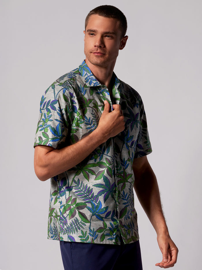 Green and blue moire-effect cotton lawn shirt, side view against plain background.