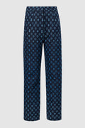 monogram denim pants in blue by buttonscarves