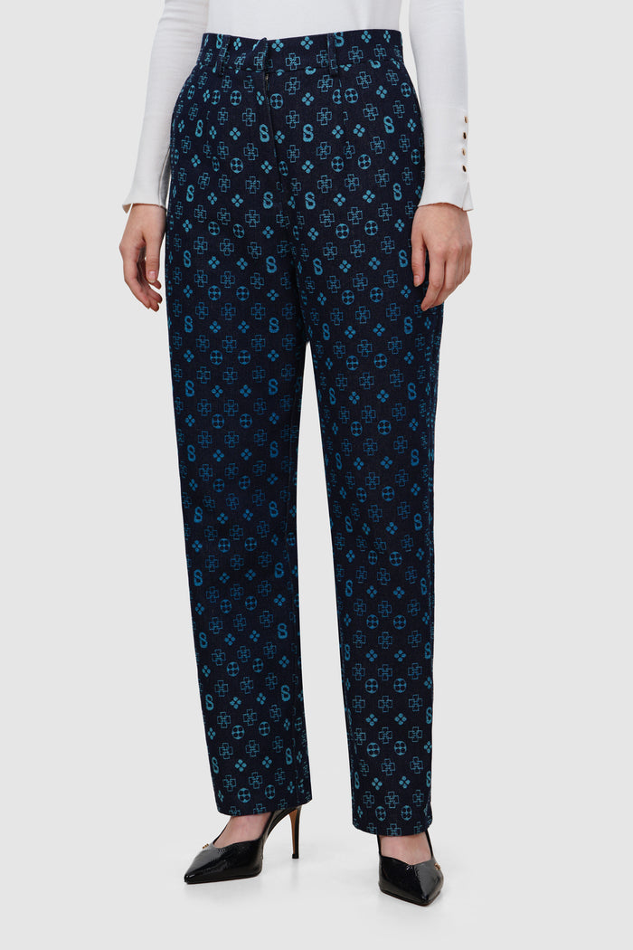 monogram denim pants in blue by buttonscarves front view