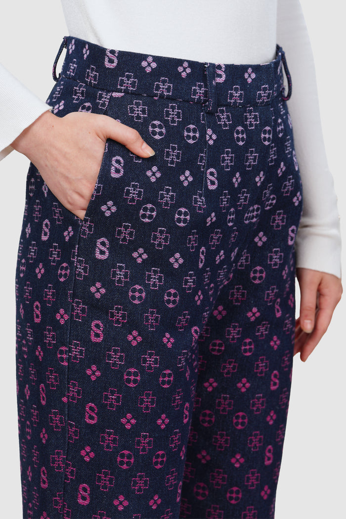 monogram denim pants in fuchsia by buttonscarves monogram pattern detail