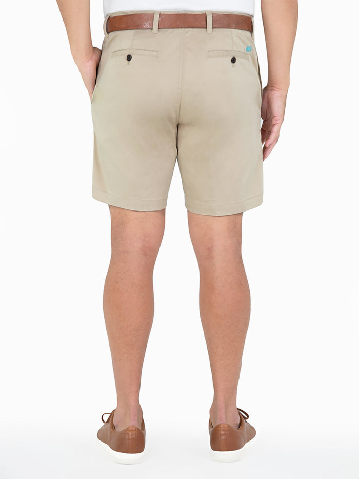 Tan solid shorts, back view, with brown belt and shoes.