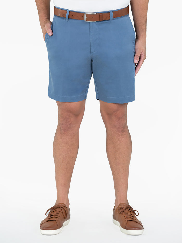Light blue knee-length shorts with white shirt and belt, front view.
