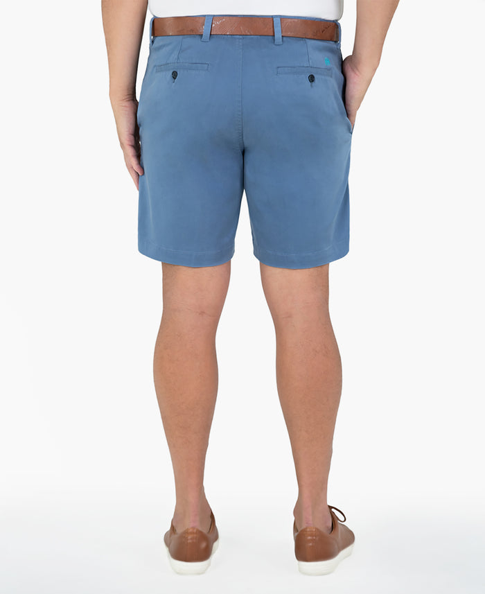Blue cotton-Tencel shorts, white shirt, brown belt, back view.