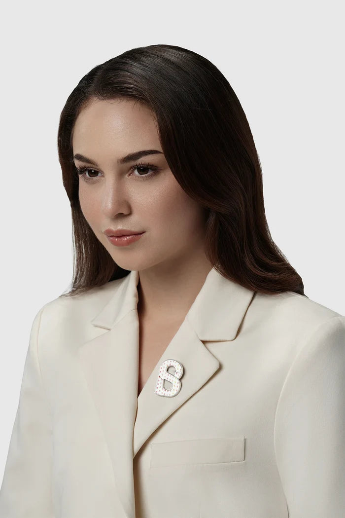 nagita brooch package in silver by buttonscarves x nagita slavina signature b logo on blazer