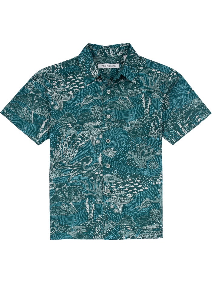Teal short-sleeve shirt with white sea creature and coral print, front view.