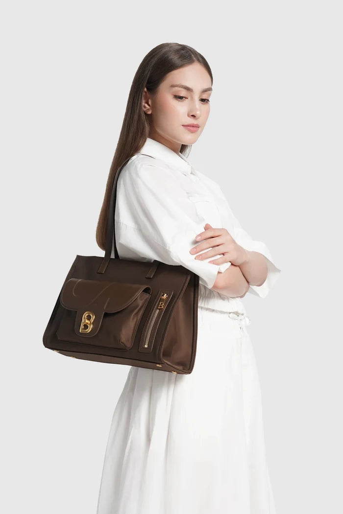 nara tote bag in brown by buttonscarves carried on shoulder