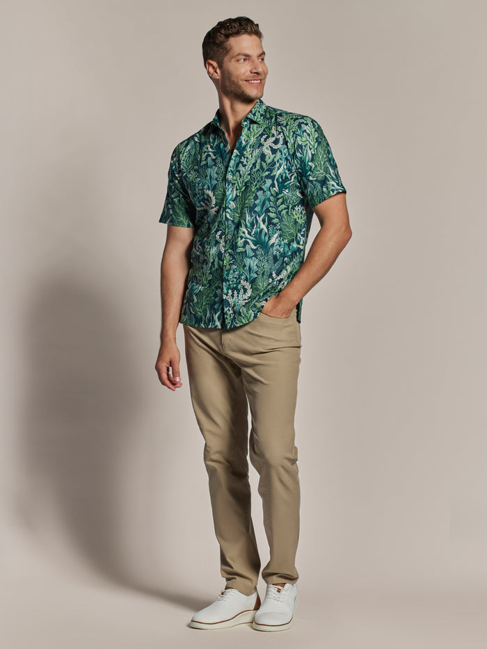 Neptunes Garden green short-sleeve shirt, tan pants, white shoes; shown in front and full front views.