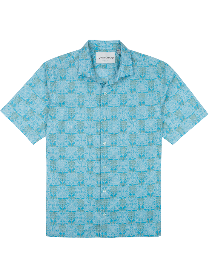 Light blue tropical-pattern short-sleeve button-up shirt, front view.