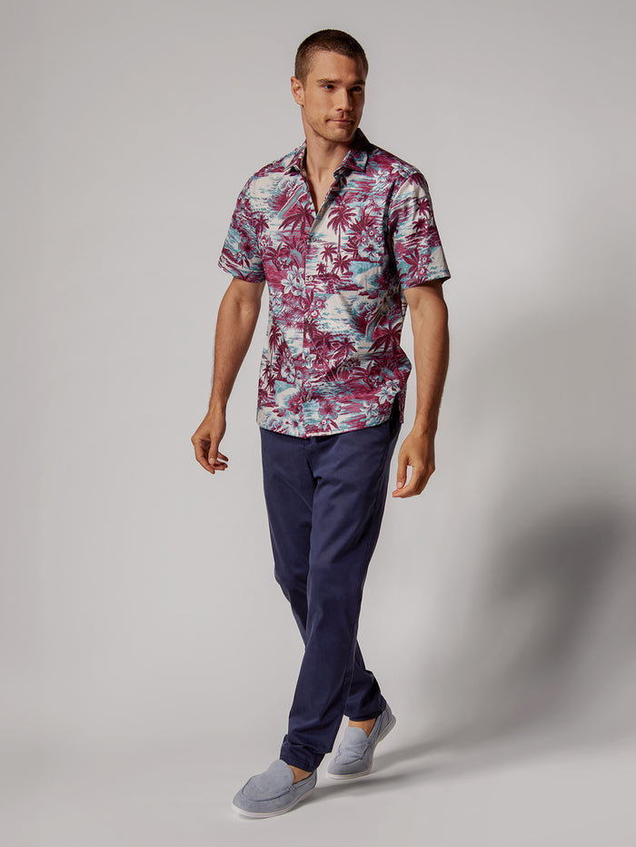Light blue and white striped short-sleeve shirt with navy pants, full body front view.