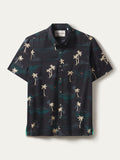 Black short-sleeve shirt with beige palm and teal mountain print, palm print, moisture-wicking fabric, front view.