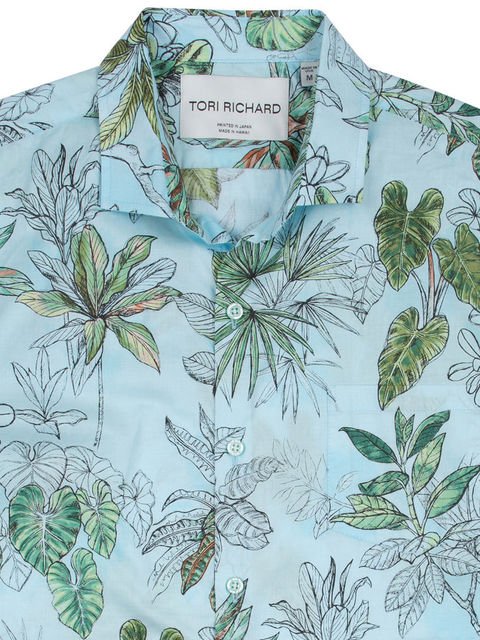 Light blue tropical print cotton shirt, close-up of collar and inner label.