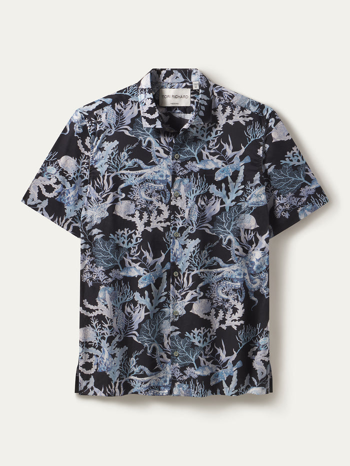 Navy shirt with light blue octopus, corals and fish print, cotton lawn fabric, front view and laid flat.