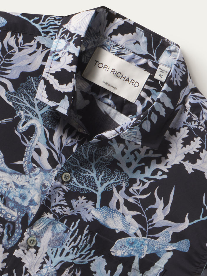 Blue and white octopus-print collared shirt, close-up of collar and label detail shown.