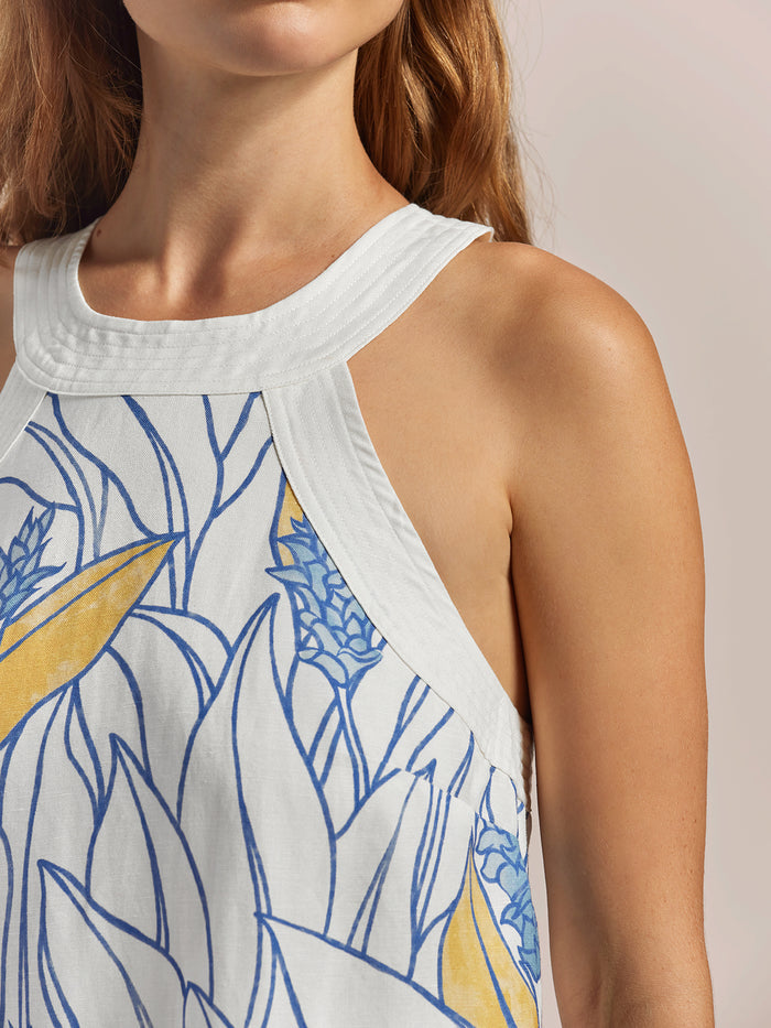 White sleeveless linen-viscose dress with blue and turmeric floral print, front view.