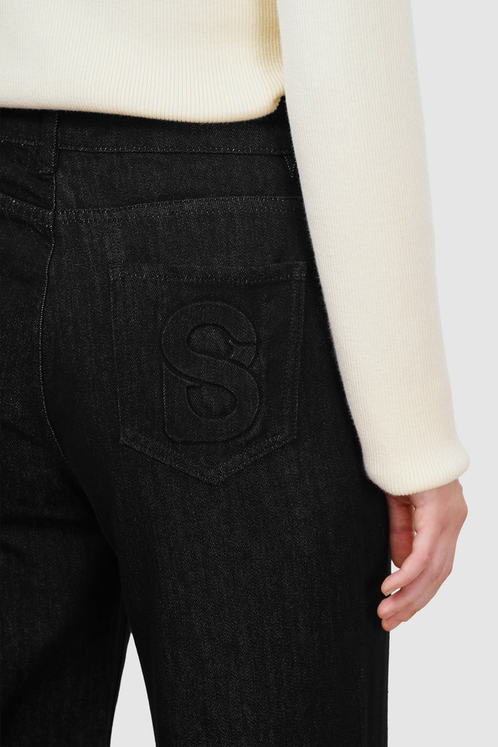 olivia denim pants in black by buttonscarves signature b detail